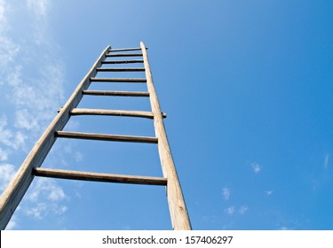 wooden ladder shot from below. getting up in the sky as a symbol of career and increase