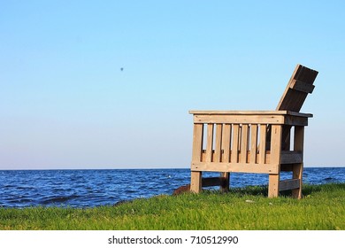 Wooden Lake Chair Overlooking Lake Mille Lacs Up North In Minnesota At Cabin In The Woods.