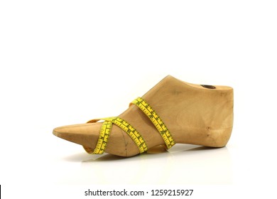 Wooden Last Shoe With Measuring Tape On White Background