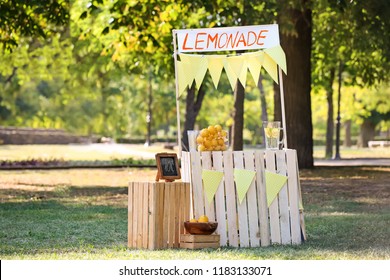 Wooden Lemonade Stand In Park On Sunny Summer Day