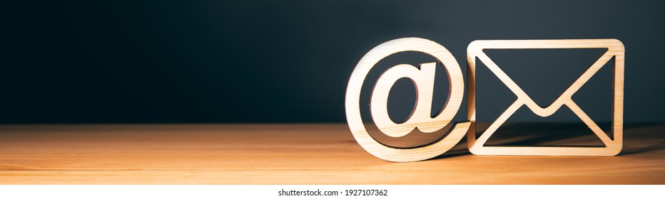 wooden letter with email sign on wooden background