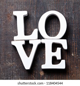 Wooden Letters Forming Word LOVE Written On Wooden Background