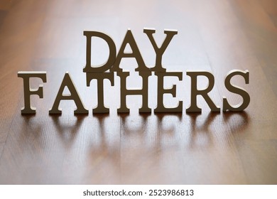 Wooden Letters Spelling "Father's Day" on a Wooden Floor Background - Powered by Shutterstock