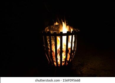 Wooden Log Fire In A Metal Brazier.