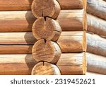 Wooden log house wall made of logs. Log house background.