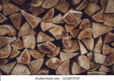 Wooden logs, beams, firewood, frame. Wooden log wooden background. Fuel. Harvesting firewood for the winter.