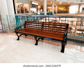 Wooden long chair bench with metal arm rest interior seat design in luxury indoor mall store building area isolated on horizontal ratio background. - Powered by Shutterstock