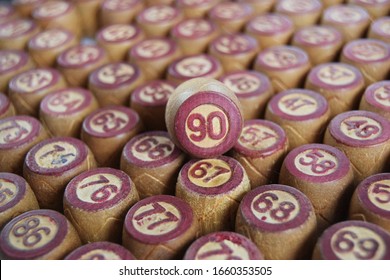 Wooden Lotto Barrels With Numbers. Isolated On A White Background. Family Bingo Game. Conceptual Photo.