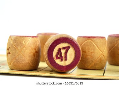 Wooden Lotto Barrels With Numbers. Isolated On A White Background. Family Bingo Game. Conceptual Photo.