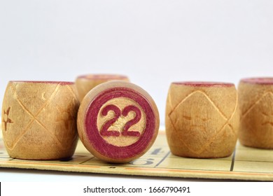 Wooden Lotto Barrels With Numbers. Isolated On A White Background. Family Bingo Game. Conceptual Photo.