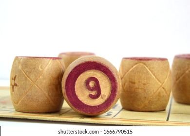 Wooden Lotto Barrels With Numbers. Isolated On A White Background. Family Bingo Game. Conceptual Photo.