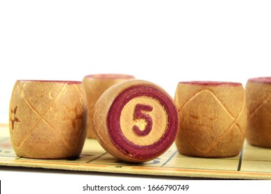 Wooden Lotto Barrels With Numbers. Isolated On A White Background. Family Bingo Game. Conceptual Photo.