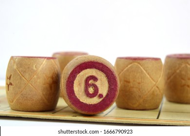 Wooden Lotto Barrels With Numbers. Isolated On A White Background. Family Bingo Game. Conceptual Photo.