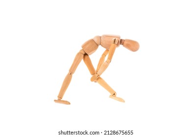 wooden man holds his leg with his hands isolated on white background. Stretch concept. High quality photo - Powered by Shutterstock