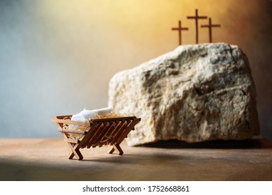 Wooden manger, three crosses background. Jesus - reason for season. Christian Christmas, Easter concept. Born to Die, Born to Rise. Salvation, Messiah, Emmanuel, God with us. Chronology of Jesus life.