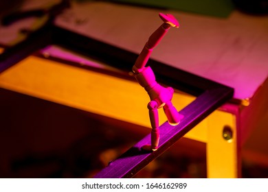 Wooden manikin balancing on picture frame- concept of creativity - Powered by Shutterstock