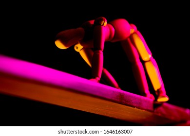 Wooden manikin balancing on picture frame- concept of creativity - Powered by Shutterstock