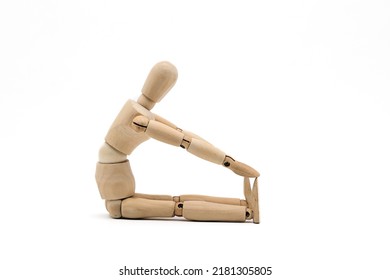 a wooden mannequin doing exercises on white background. warm up exercise	 - Shutterstock ID 2181305805