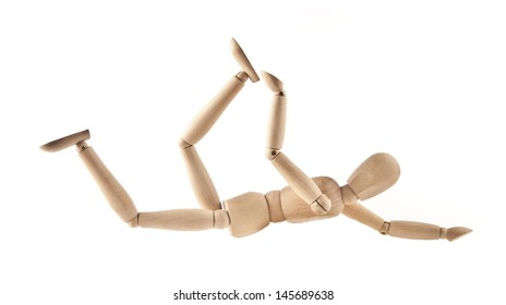 Wooden mannequin falls and stretches Isolated on white background 