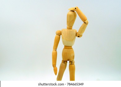 Wooden Mannequin Figure Hand To Head - Body Language Bad Idea. Oops.