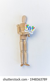 Wooden Mannequin Holding A Happy Birthday Sign On White Background