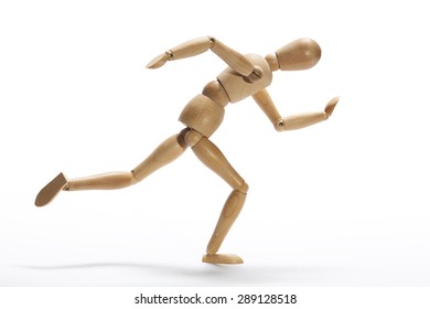 Wooden mannequin in intense sprint on a white background - Shutterstock ID 289128518