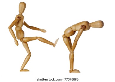 wooden mannequin kicking butt of another one bending down