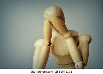 Wooden mannequin looking desperate and depressed - Concept of depression and mental health problems - Powered by Shutterstock