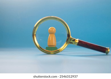 Wooden mannequin modeling a person in the concept of seeking leadership - Powered by Shutterstock