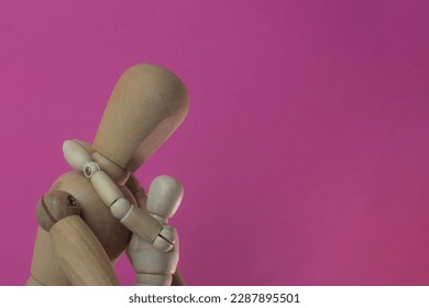 Wooden mannequin parent hugging their child in a rose background - Powered by Shutterstock