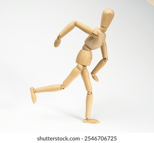 a wooden mannequin while running or on a white background - Powered by Shutterstock