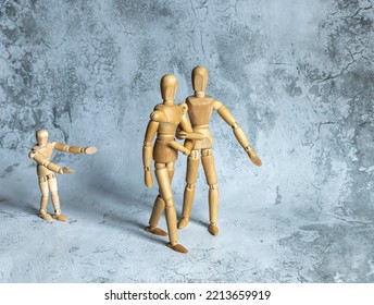 Wooden Mannequins As Father And Mother Leaving A Lonely Child