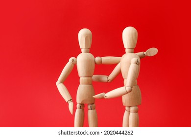 Wooden mannequins on color background. Concept of support - Powered by Shutterstock