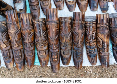 Wooden masks or tribal masks, wall hanging handicrafts, on display during the Handicraft Fair in Kolkata - the biggest handicrafts fair in Asia.