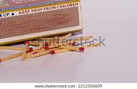 Wooden matches with striker on white