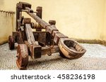 Wooden Medieval Catapult Ballistic Device. Ancient Military Technology
