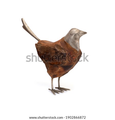 Wooden and metal bird figurine isolated on a white background