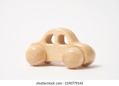 The Wooden Miniature Car In White Background