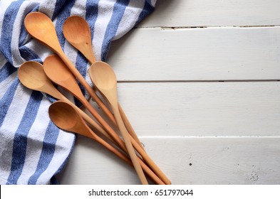 Wooden Mixing Spoons And Dish Towel