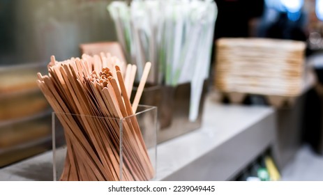 Wooden mixing sticks in coffe shop close up - Powered by Shutterstock