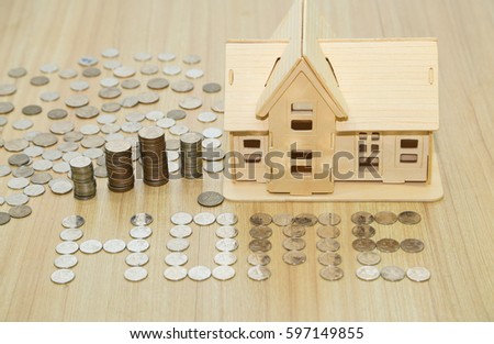 wooden model and coints are symbol homeloan