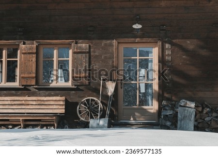wooden mountain chalet front in rural atmosphere