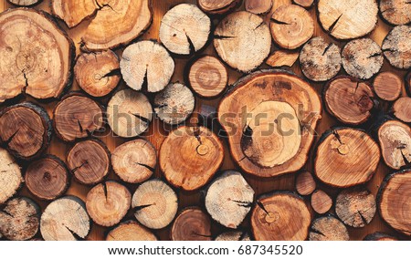 Wooden natural sawn logs as background, top view, flat lay