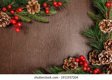 Christmas Evergreen Branches and Berries Over Rustic Wood Background   Christmas stock photos Christmas background Rustic wood background