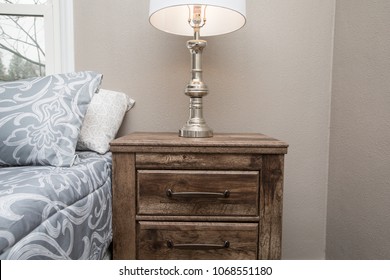 Wooden Night Stand Or Bedside Table In A Bedroom