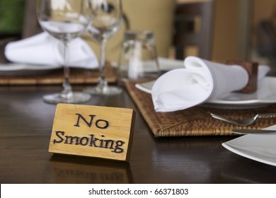 Wooden No Smoking Sign On Wood Dining Table In Restaurant