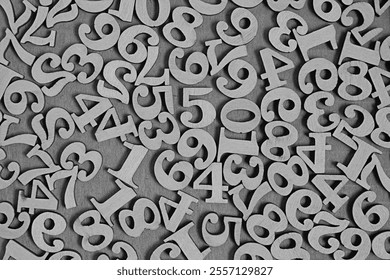 Wooden numbers from zero to nine on a gray background, abstract background