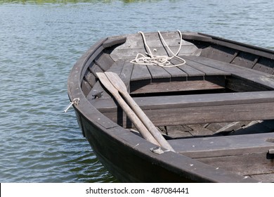 Wooden Oars In Rowing Boat On Lake.