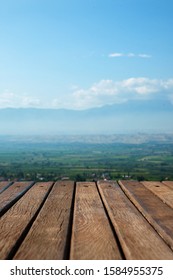 Wooden Old Background On Natural Background With Mountain And Sky Blurred View. Selective Focus, Shallow Depth. Copyspace.