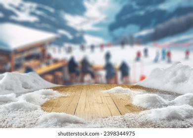 Wooden old desk cover of snow and frost. Winter time in Alps. Blurred background of mountains. Empty space for your decoration. Christmas time. 